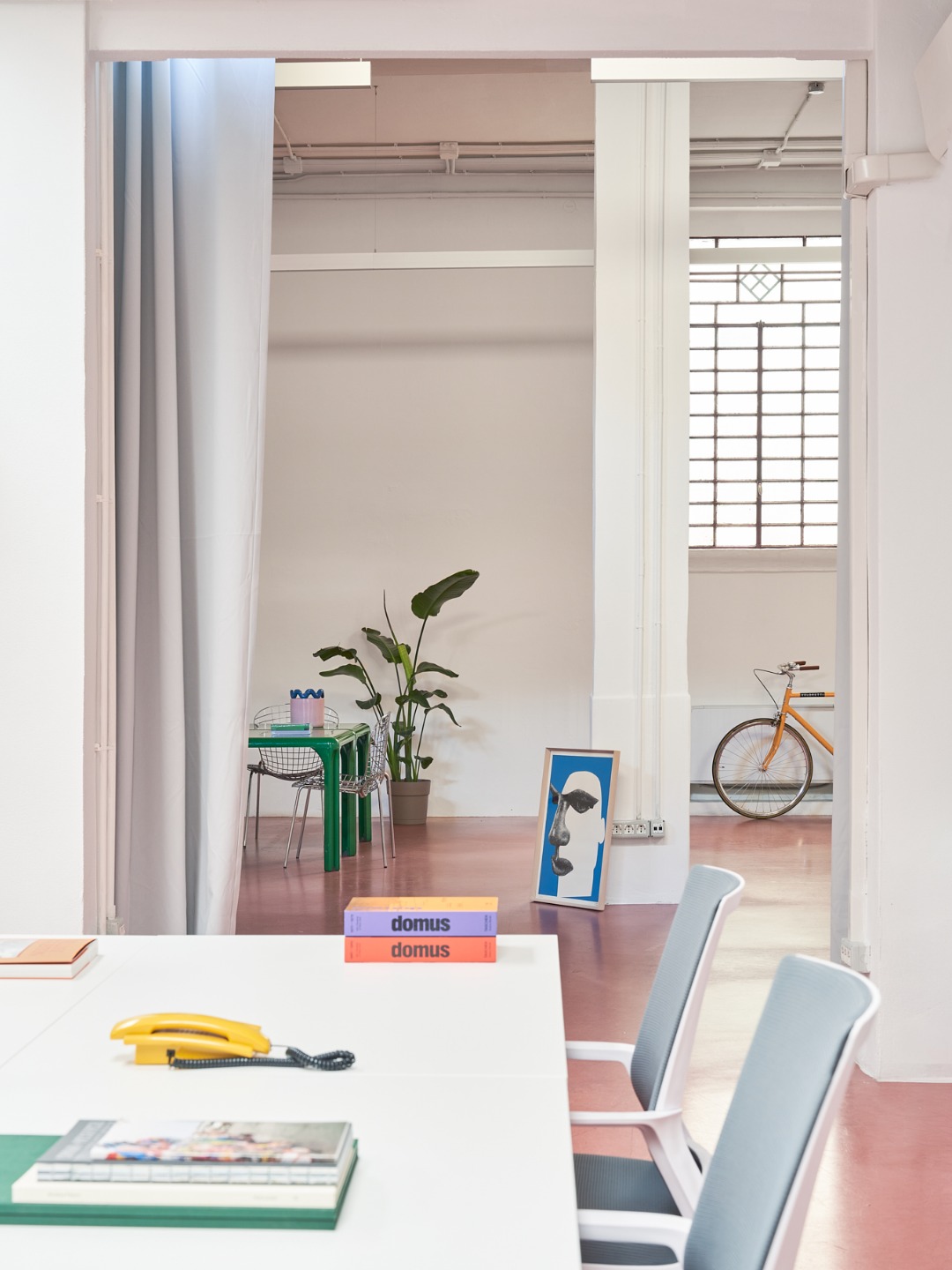 Adatto dining table and silver curtain